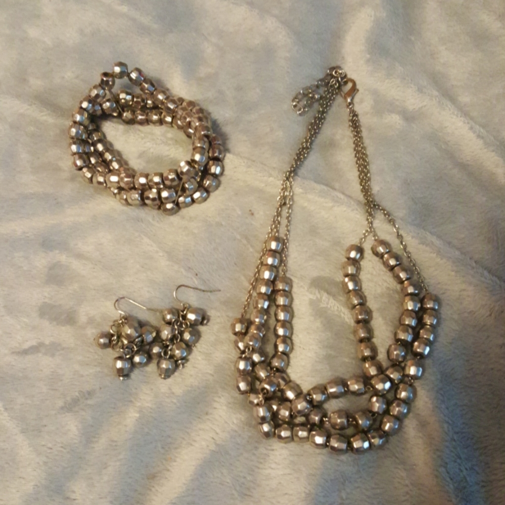 Silvertone necklace, bracelet, and earring set